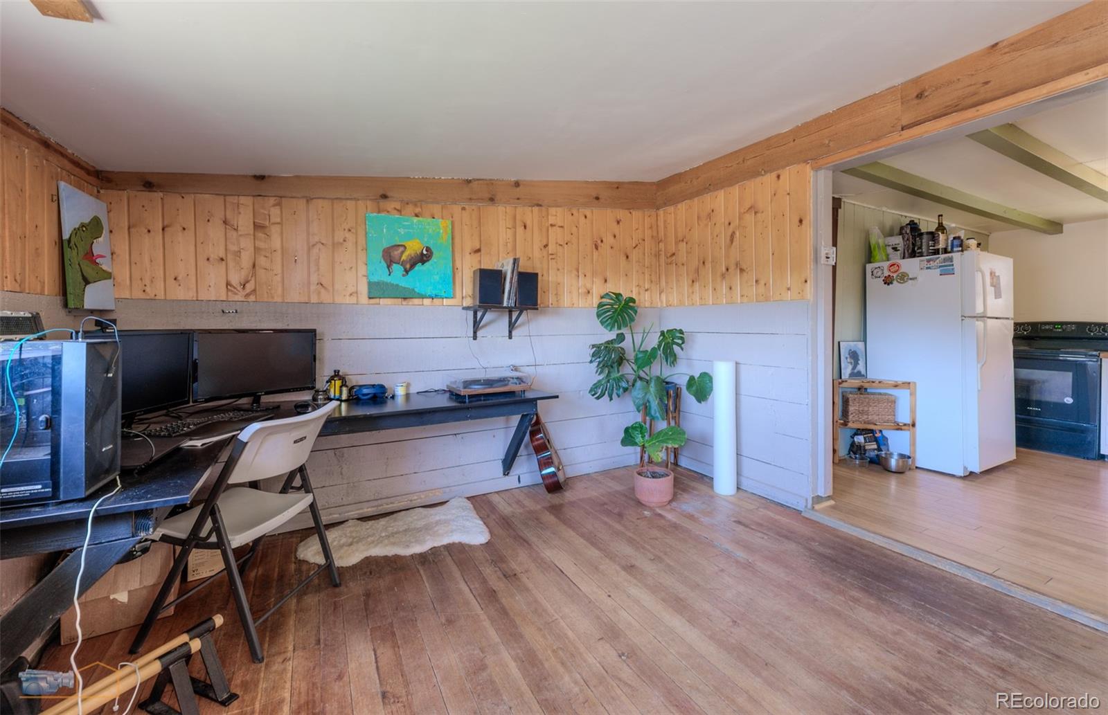 548 Coughlin Meadows Road Boulder, CO 80302 - Photo 43 of 49 a view of a workspace with furniture and wooden floor