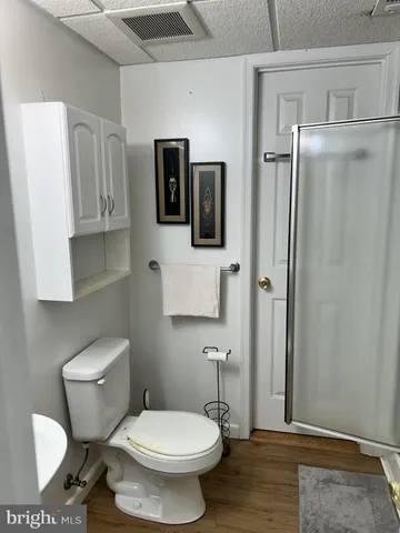 a white toilet sitting next to a bathroom sink