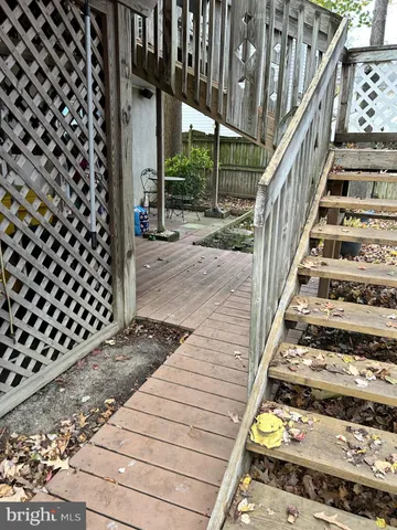 a view of a balcony with wooden floor