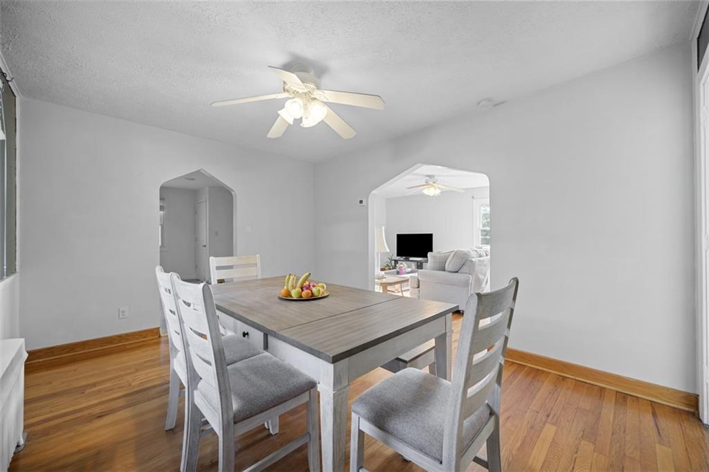 991 Forsythe Road Carnegie, PA 15106 - Photo 11 of 49 a view of a dining room with furniture and wooden floor