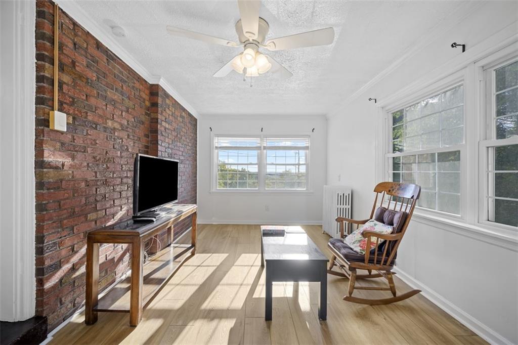 991 Forsythe Road Carnegie, PA 15106 - Photo 18 of 49 a view of livingroom with furniture window and wooden floor