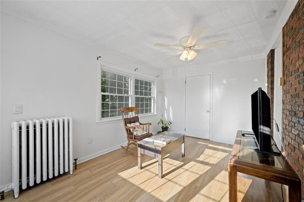 991 Forsythe Road Carnegie, PA 15106 - Photo 19 of 49 a living room with furniture a flat screen tv and a window