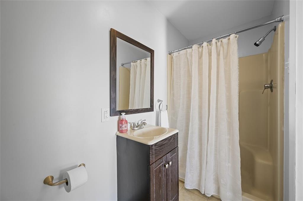 991 Forsythe Road Carnegie, PA 15106 - Photo 20 of 49 a bathroom with a sink and a mirror