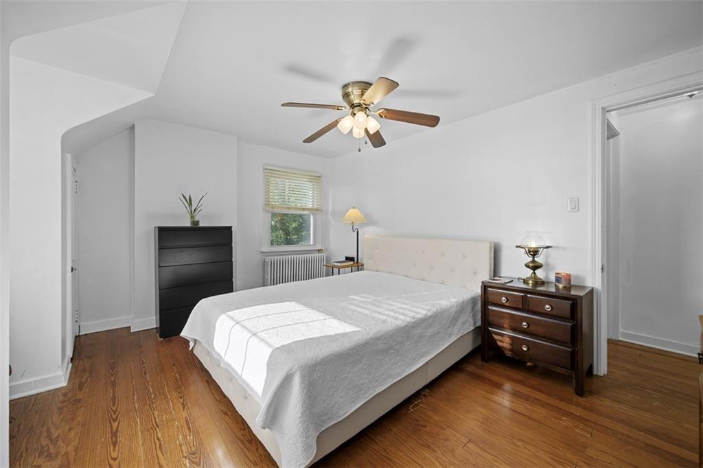 991 Forsythe Road Carnegie, PA 15106 - Photo 22 of 49 a bedroom with a bed and wooden floor