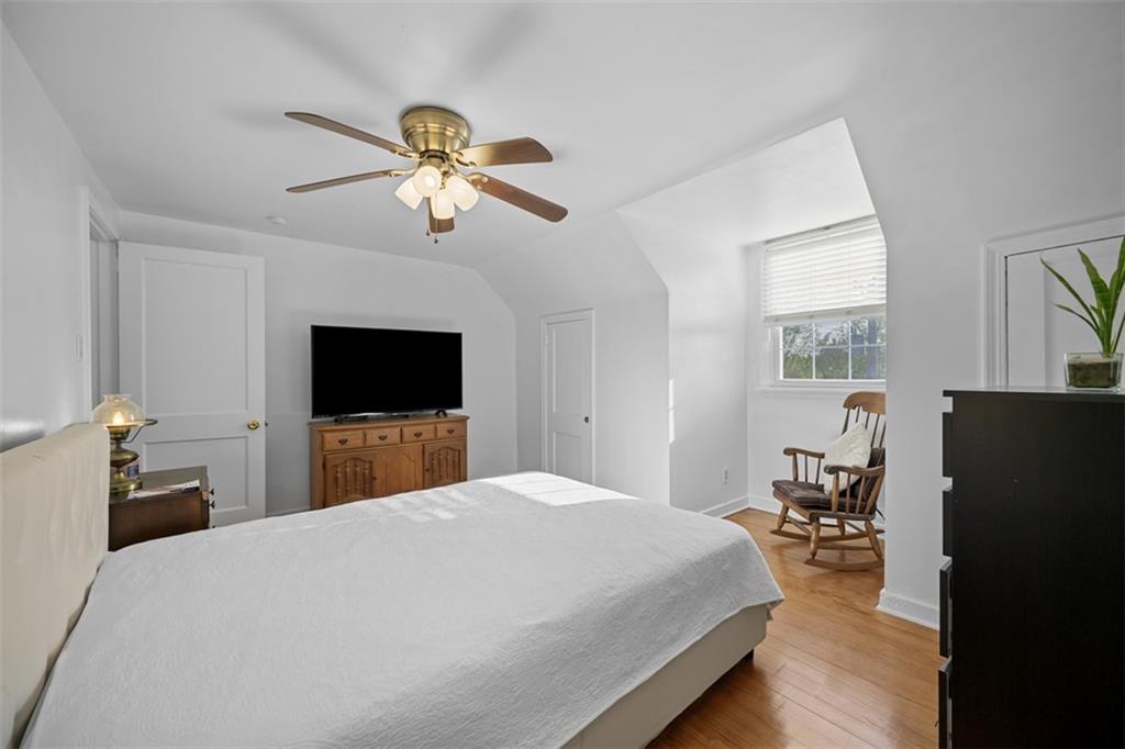 991 Forsythe Road Carnegie, PA 15106 - Photo 23 of 49 a bedroom with a bed and wooden floor