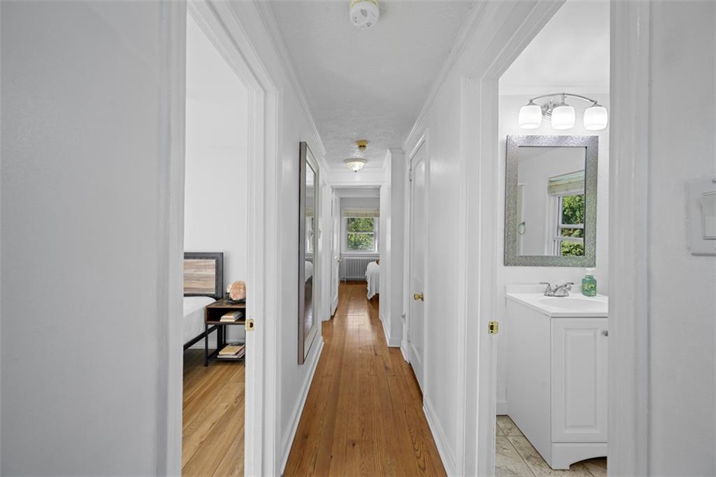 991 Forsythe Road Carnegie, PA 15106 - Photo 25 of 49 a view of a hallway with wooden floor and a bathroom