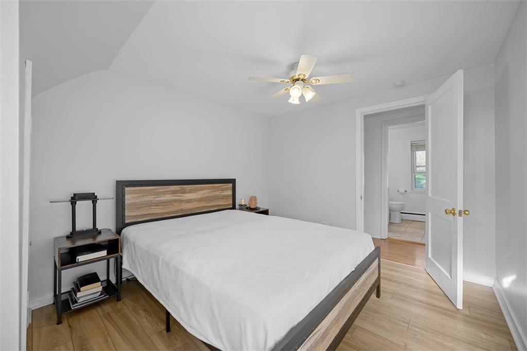 991 Forsythe Road Carnegie, PA 15106 - Photo 27 of 49 a bedroom with a bed and a chandelier