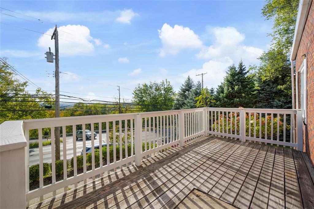 991 Forsythe Road Carnegie, PA 15106 - Photo 3 of 49 a balcony with wooden floor