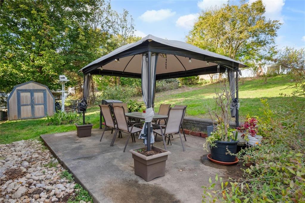 991 Forsythe Road Carnegie, PA 15106 - Photo 37 of 49 a view of a chair and table in the garden