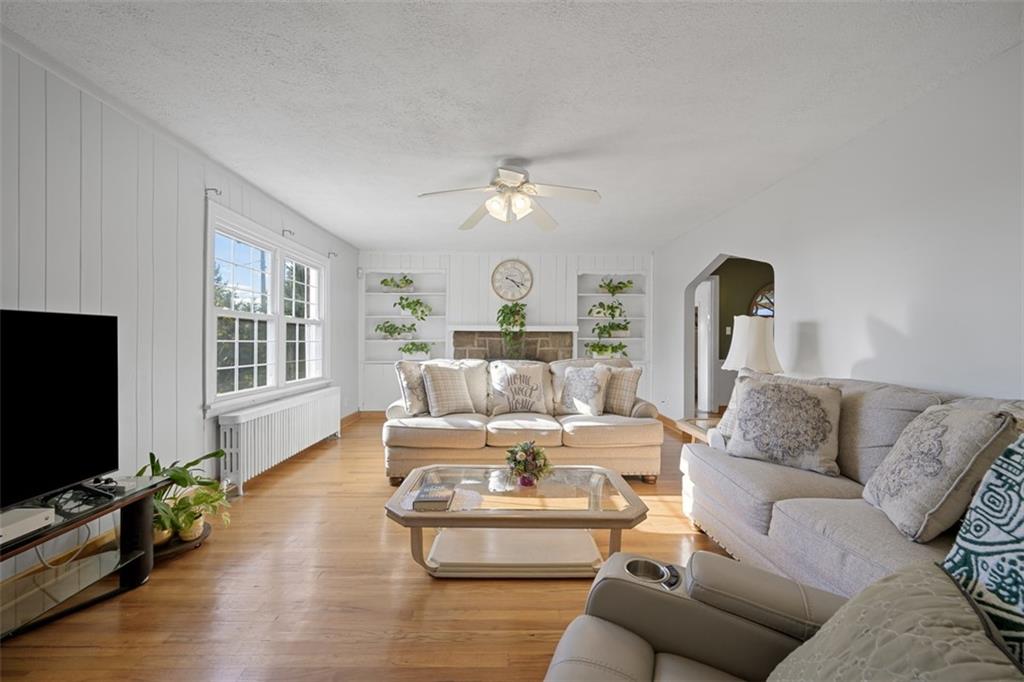 991 Forsythe Road Carnegie, PA 15106 - Photo 6 of 49 a living room with furniture fireplace and flat screen tv