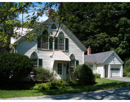 98 Depot Road Leverett, MA 01054 - Photo 1 of 1 a front view of a house with a yard and potted plants