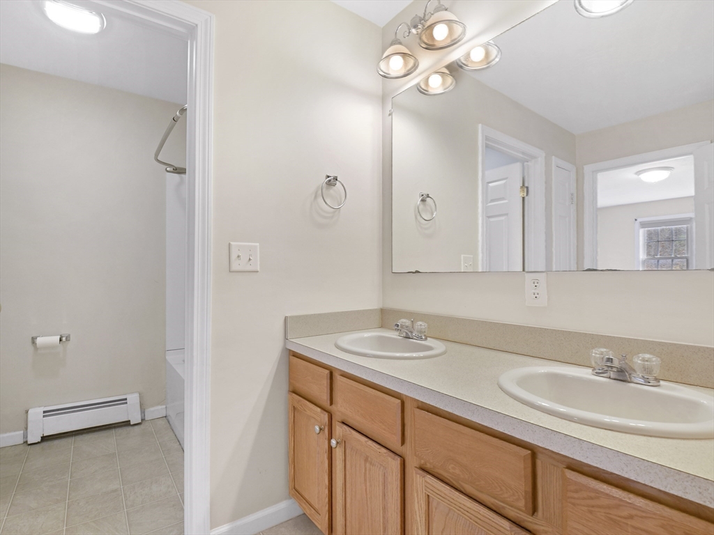 350 Riverbend Street, Unit 108 Athol, MA 01331 - Photo 13 of 27 a bathroom with a sink a vanity and a mirror