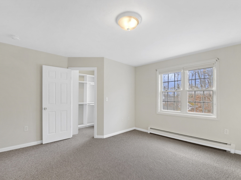 350 Riverbend Street, Unit 108 Athol, MA 01331 - Photo 17 of 27 an empty room with a empty space and windows