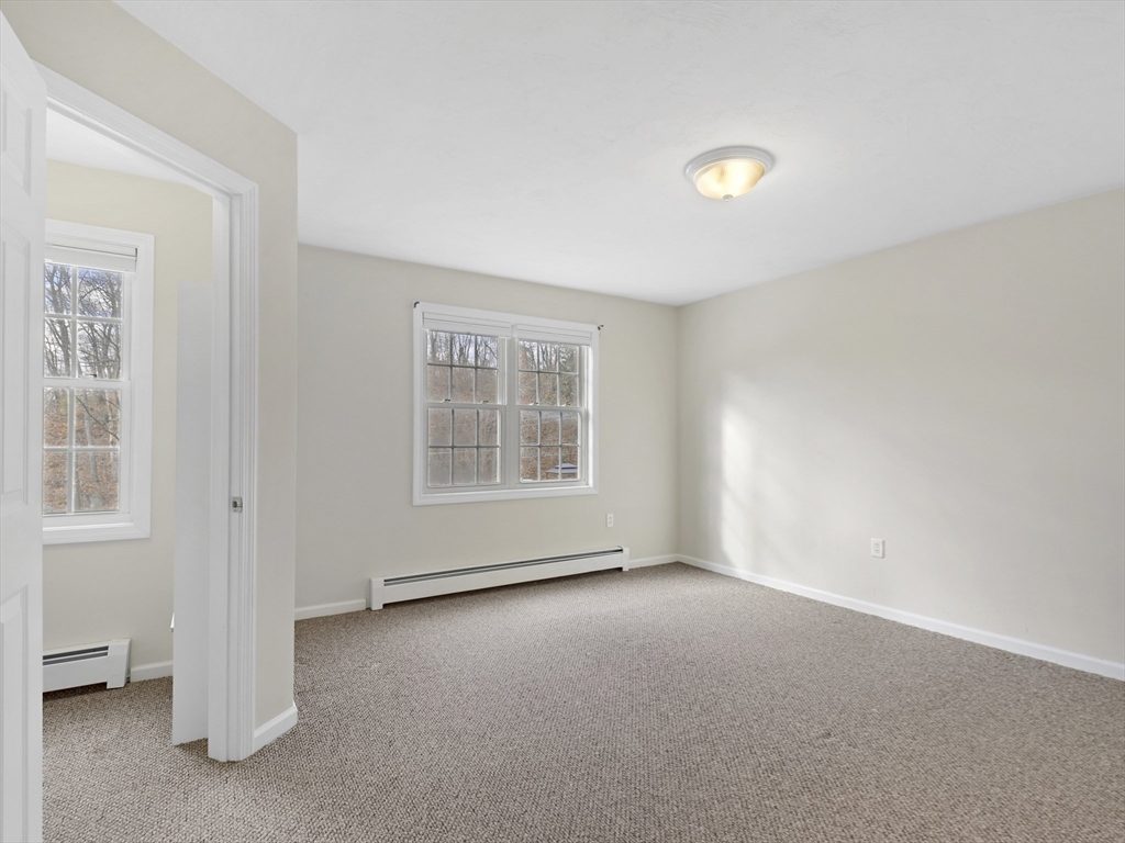 350 Riverbend Street, Unit 108 Athol, MA 01331 - Photo 18 of 27 an empty room with windows