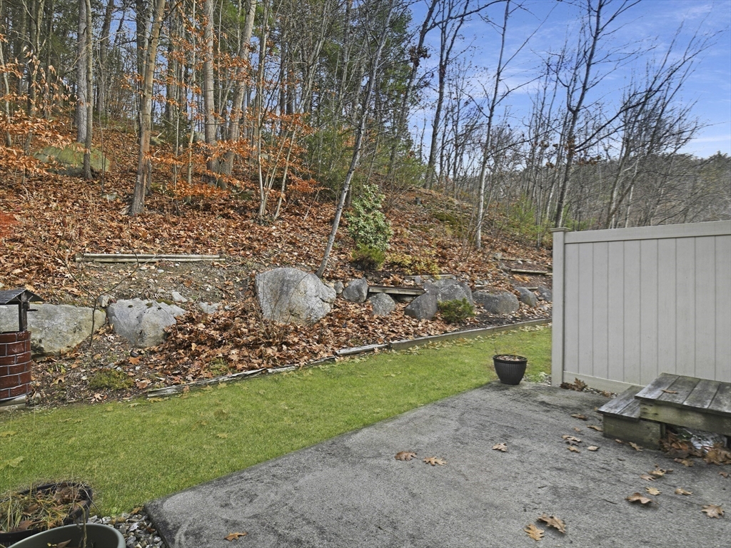 350 Riverbend Street, Unit 108 Athol, MA 01331 - Photo 20 of 27 a view of a backyard with plants and trees