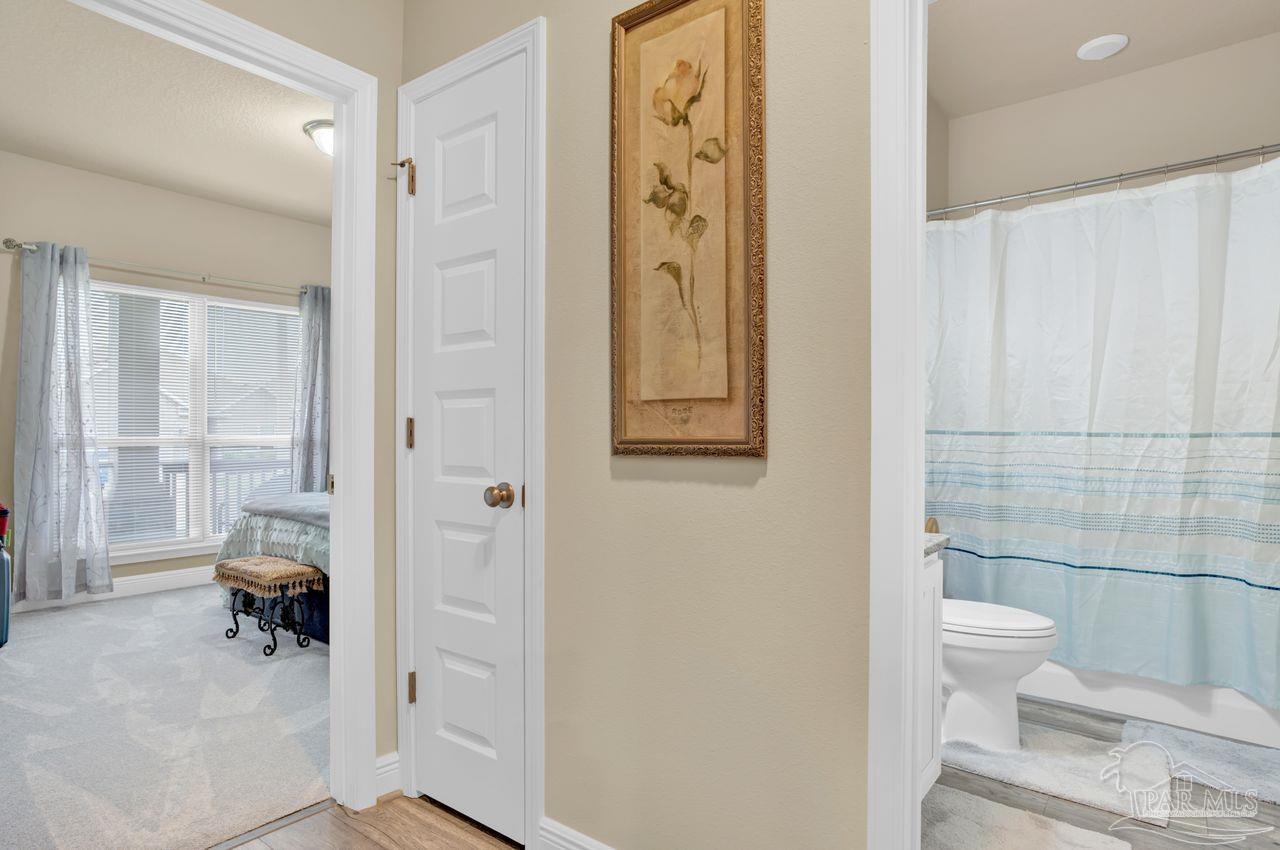 5364 Red Shoulder Road Pace, FL 32571 - Photo 12 of 46 a bathroom with a toilet and a shower
