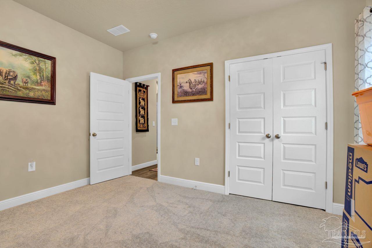 5364 Red Shoulder Road Pace, FL 32571 - Photo 18 of 46 an empty room with closet area