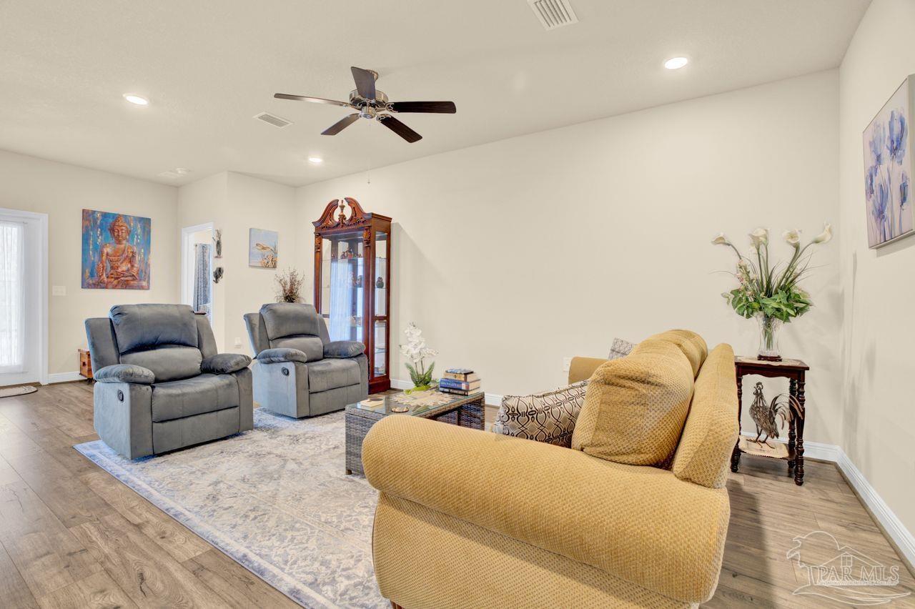 5364 Red Shoulder Road Pace, FL 32571 - Photo 23 of 46 a living room with furniture