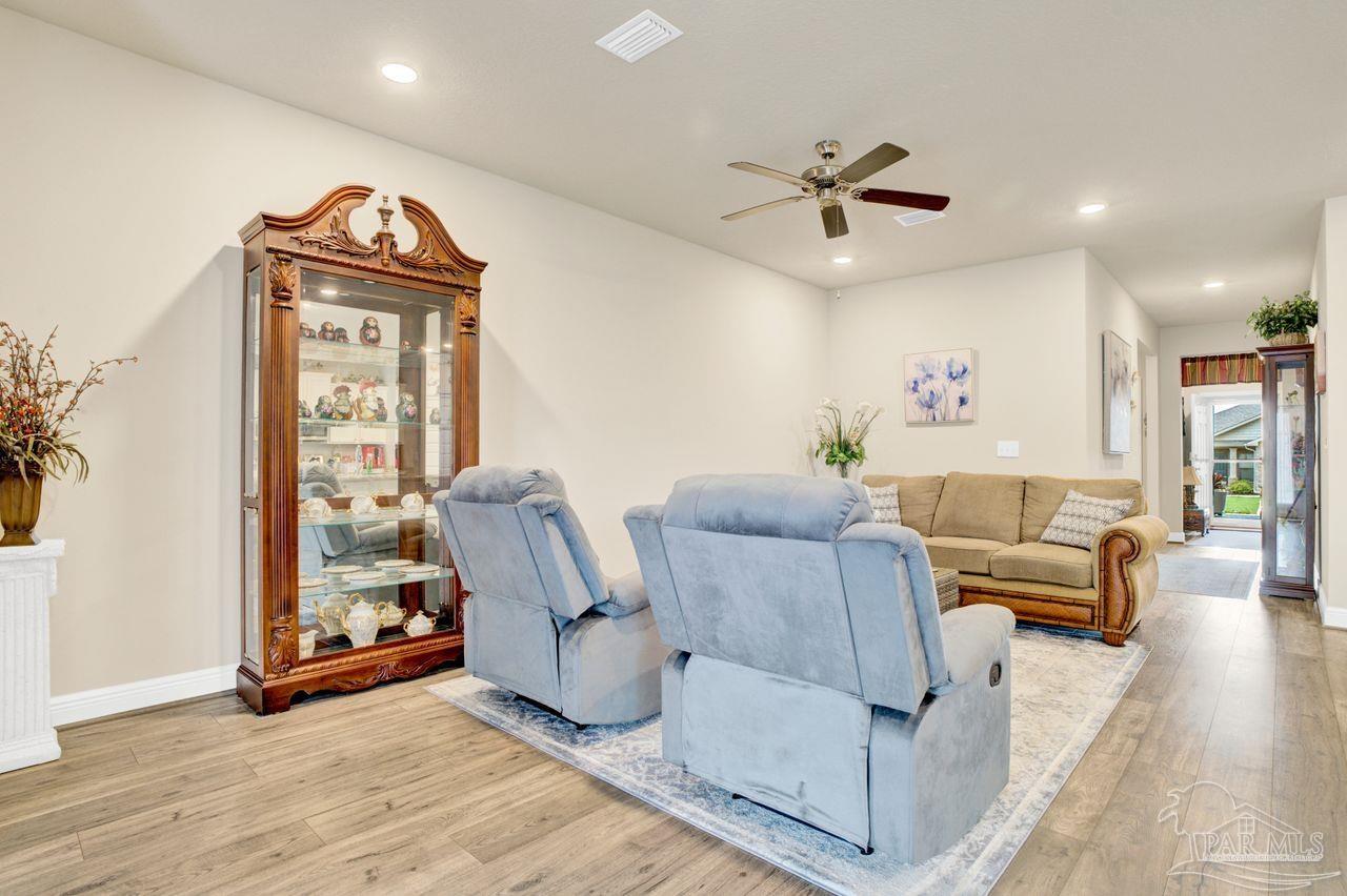 5364 Red Shoulder Road Pace, FL 32571 - Photo 24 of 46 a living room with furniture and a window