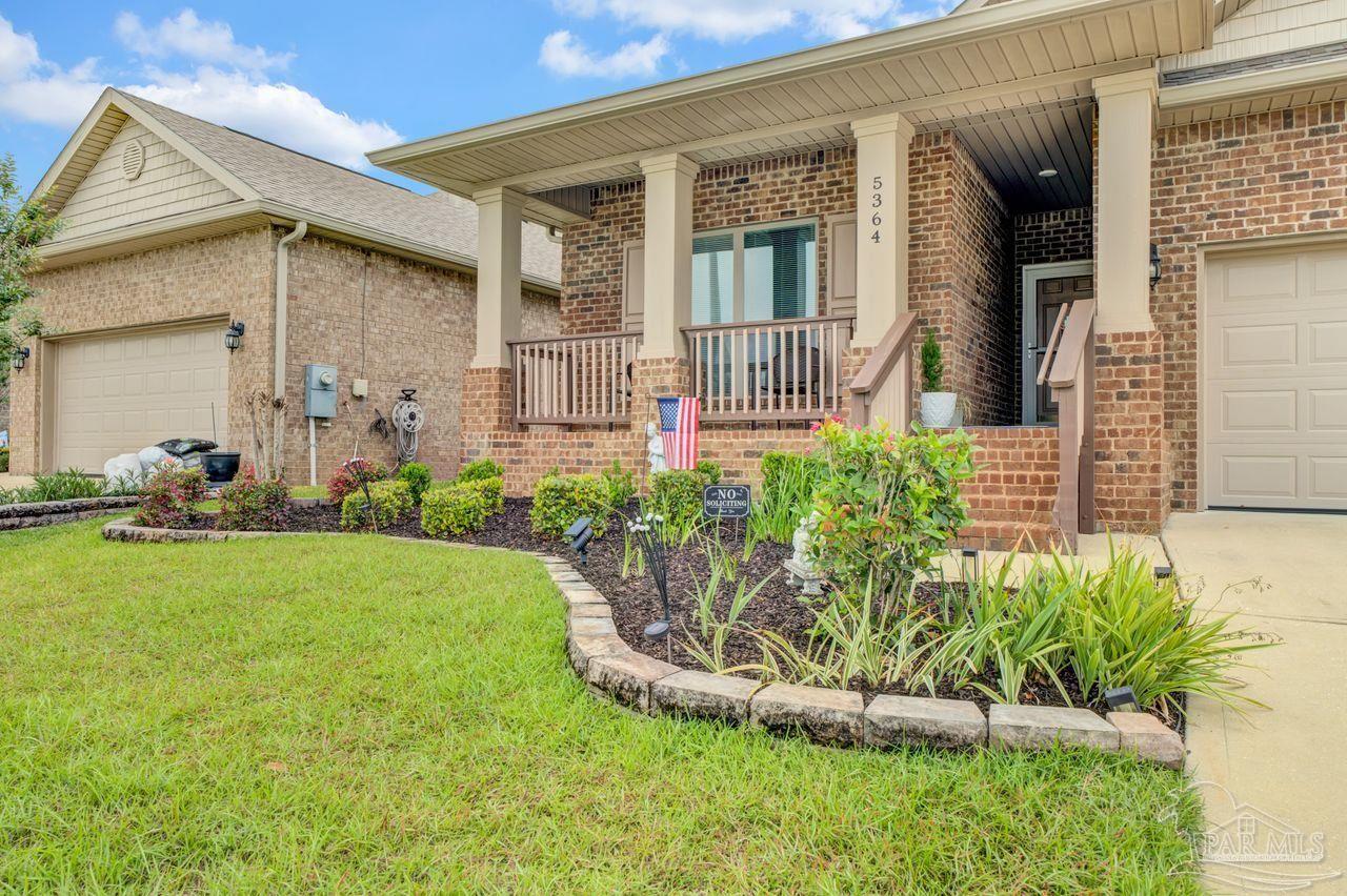 5364 Red Shoulder Road Pace, FL 32571 - Photo 3 of 46 front view of a house with a yard