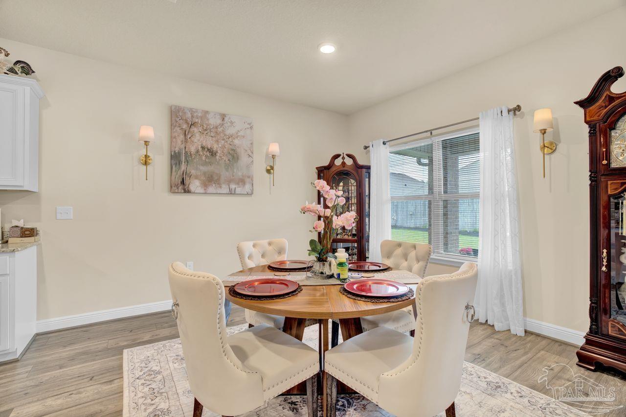 5364 Red Shoulder Road Pace, FL 32571 - Photo 32 of 46 a view of a dining room with furniture window and outside view