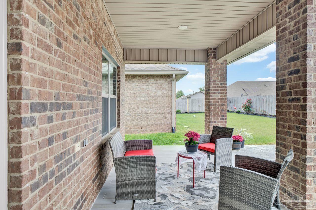 5364 Red Shoulder Road Pace, FL 32571 - Photo 46 of 46 a view of an outdoor sitting area in a backyard