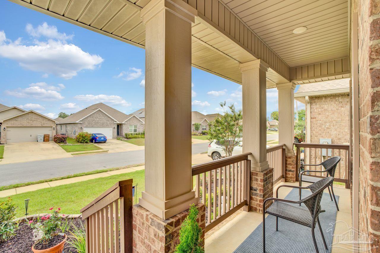 5364 Red Shoulder Road Pace, FL 32571 - Photo 5 of 46 a view of balcony with two chairs and a table