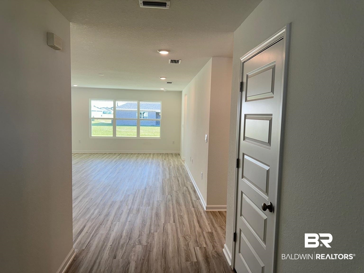 24385 Ringneck Loop Elberta, AL 36530 - Photo 11 of 33 Hallway with light hardwood / wood-style flooring