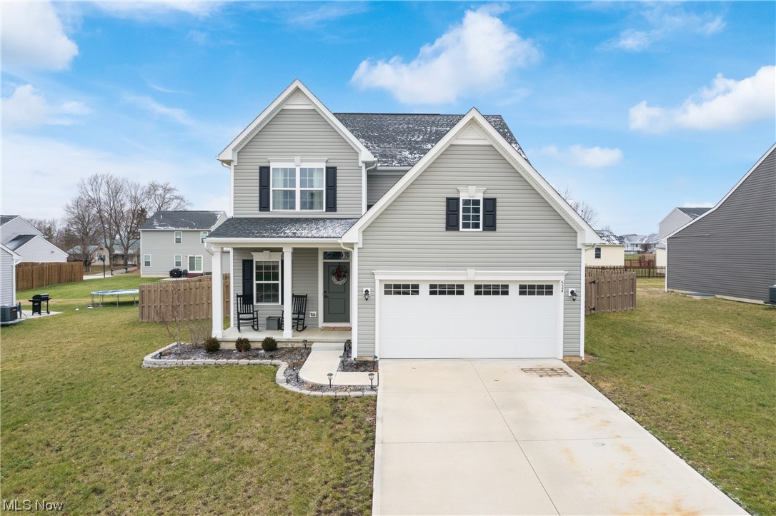 524 Oliver Way Rittman, OH 44270 - Photo 1 of 33 View of front of home with a front yard and a porch