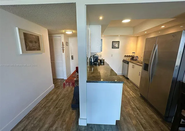 a view of a living room and wooden floor