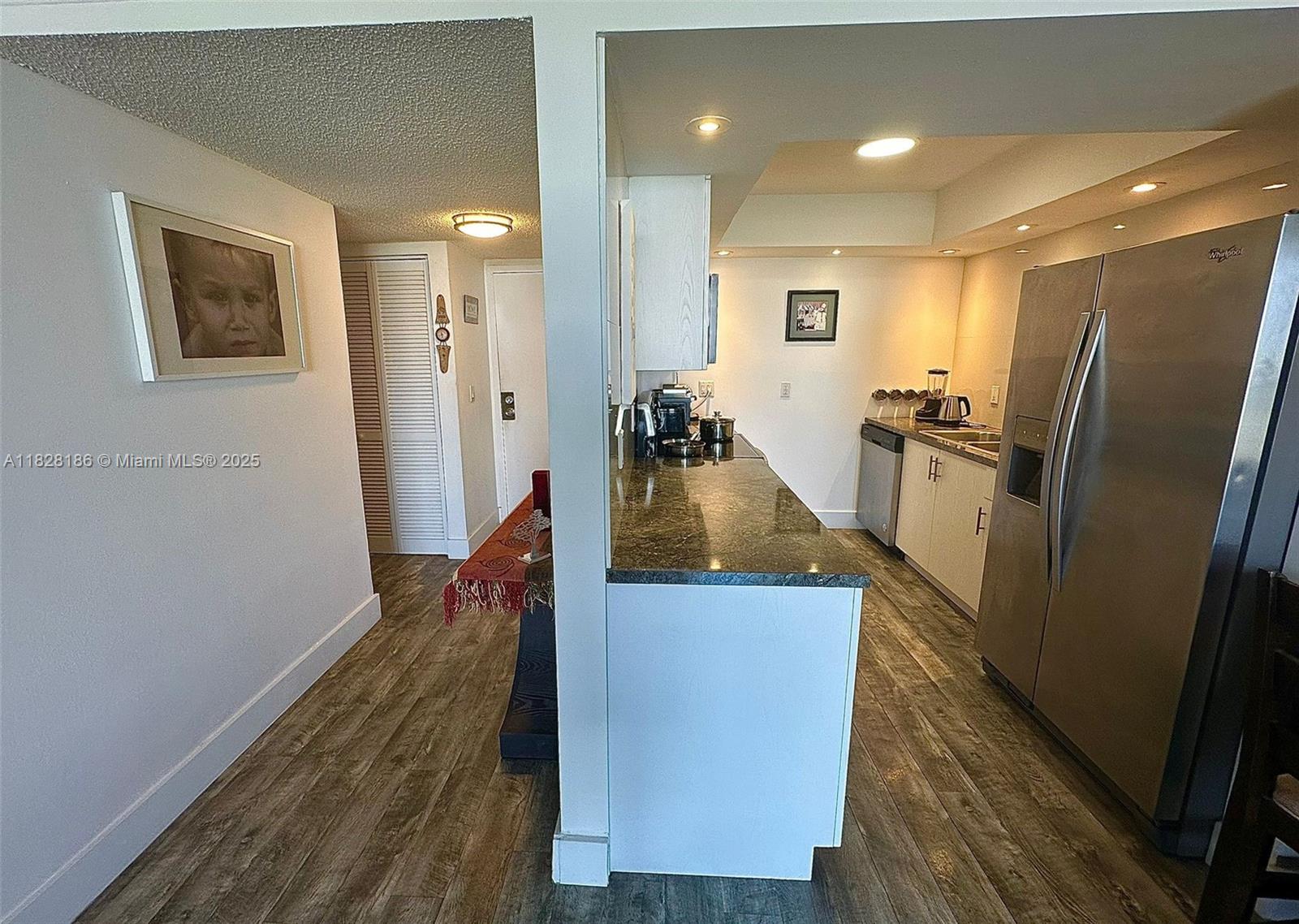 13499 Biscayne Boulevard, Unit 1013 North Miami, FL 33181 - Photo 6 of 25 a view of a living room and wooden floor