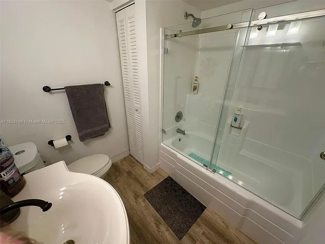 a bathroom with a tub and a shower