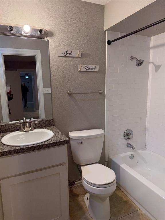9805 Walnut Street, Unit C102 Dallas, TX 75243 - Photo 6 of 15 a bathroom with a sink toilet and shower
