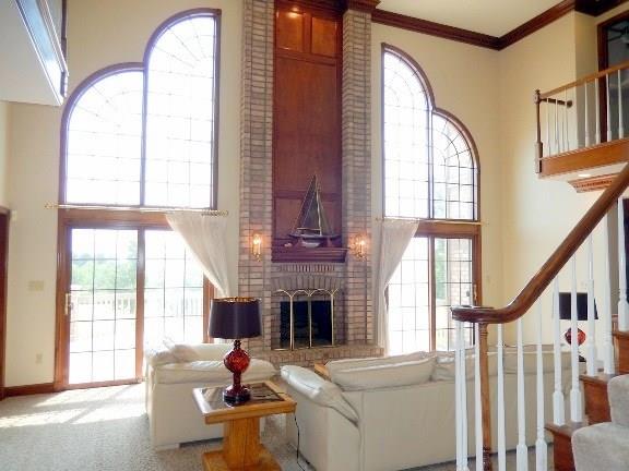 260 High Acres Road Harmony, PA 16037 - Photo 3 of 25 A grand Two Story family room welcomes in natural light pours through transom windows.