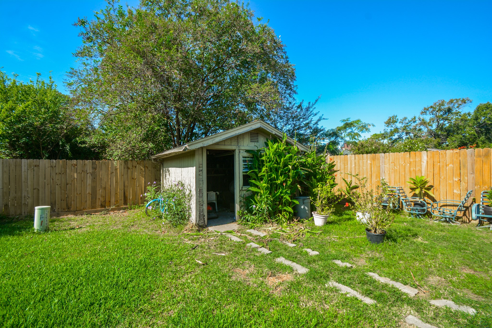13630 Oleoke Lane Houston, TX 77015 - Photo 14 of 16 a view of a backyard with plants and lake view