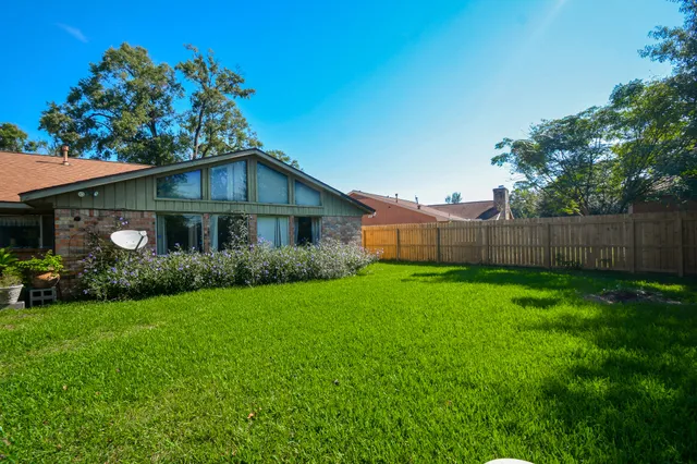 a view of a back yard of the house