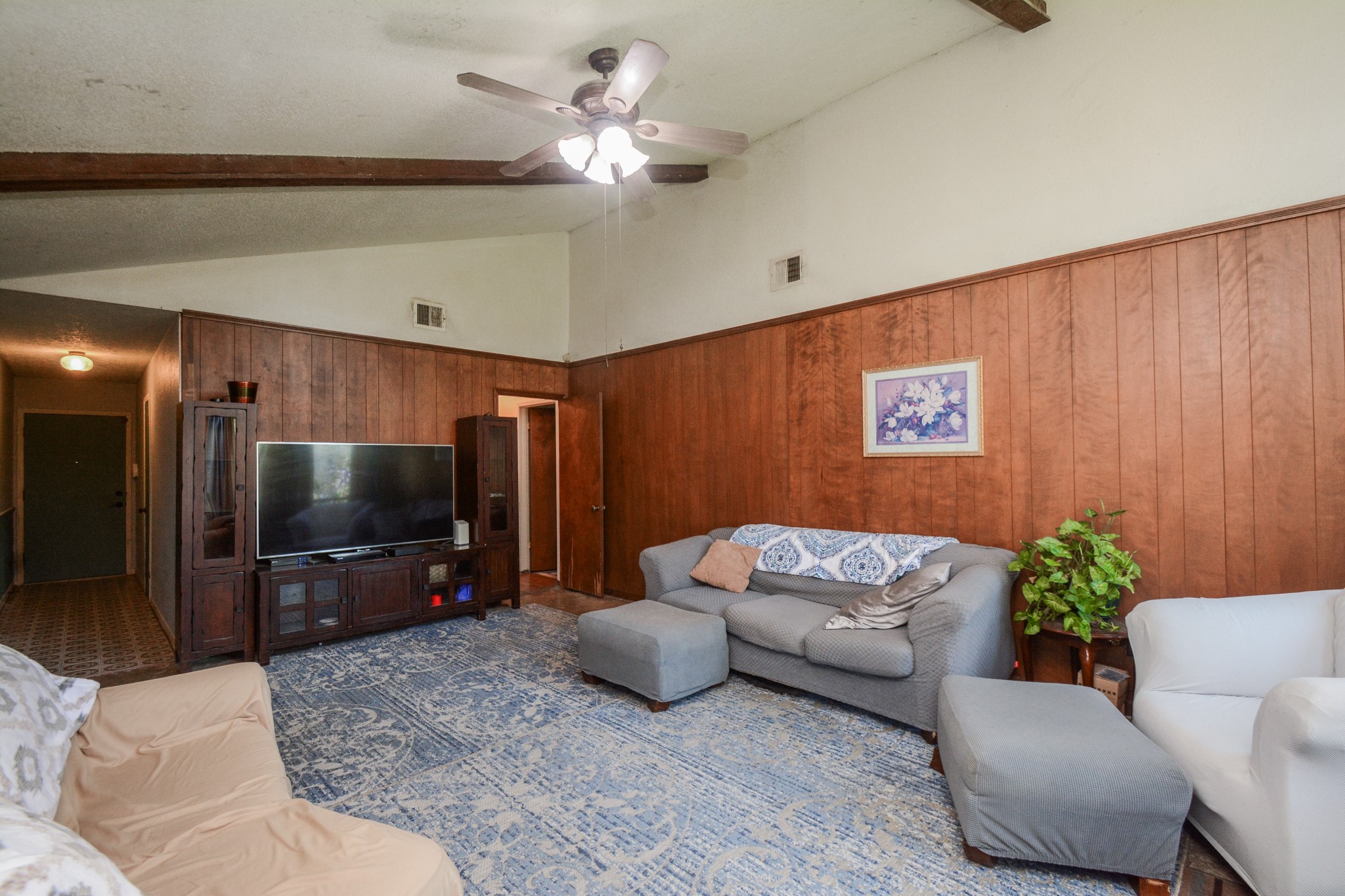 13630 Oleoke Lane Houston, TX 77015 - Photo 4 of 16 a living room with furniture and a flat screen tv