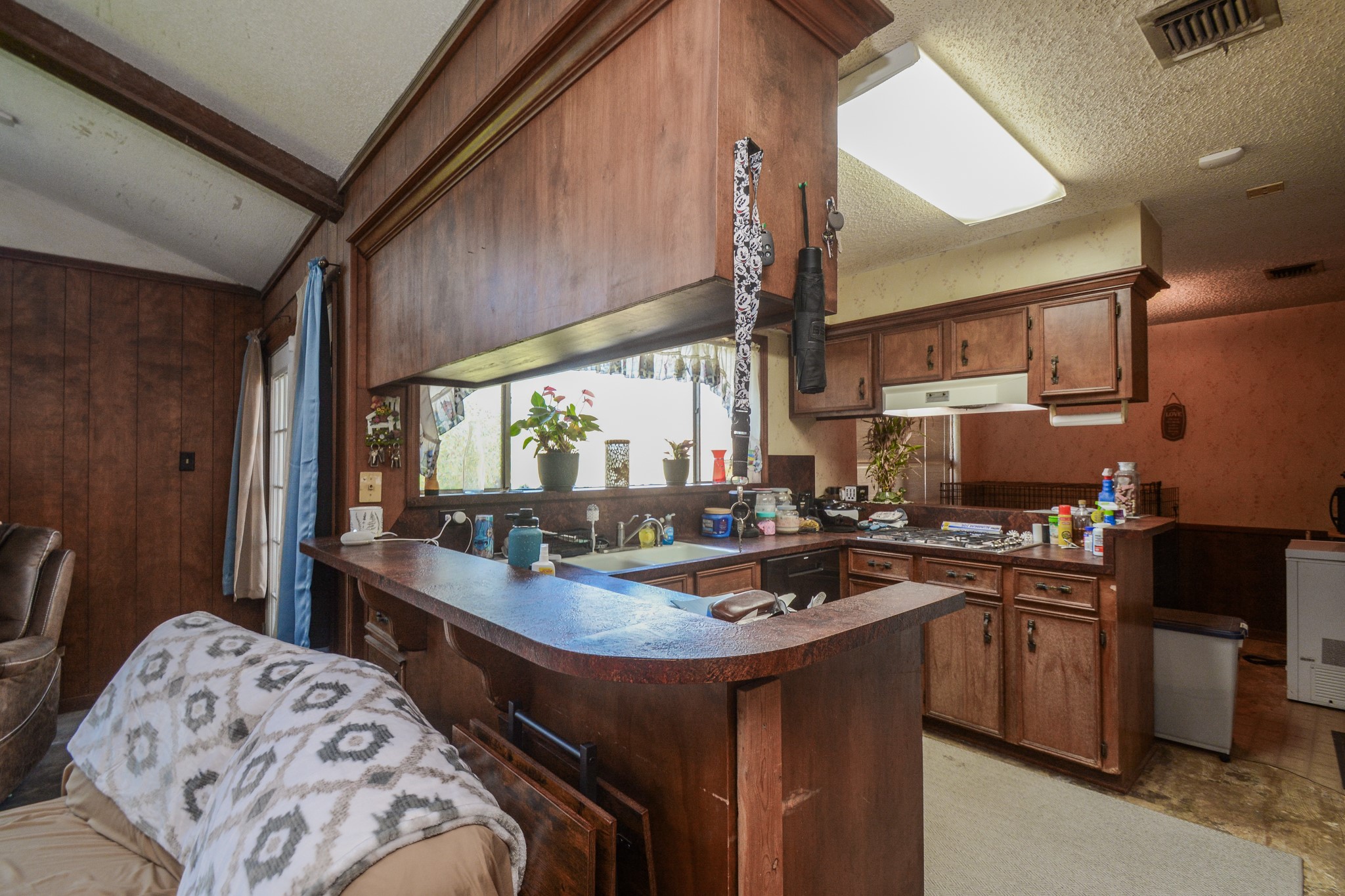 13630 Oleoke Lane Houston, TX 77015 - Photo 7 of 16 a kitchen with a sink a stove and cabinets
