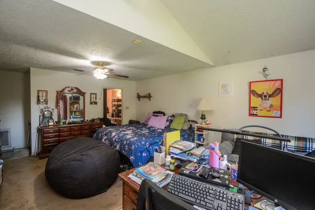 a bed room with furniture and wooden floor