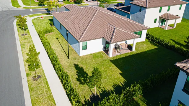 a aerial view of a house with a garden and plants