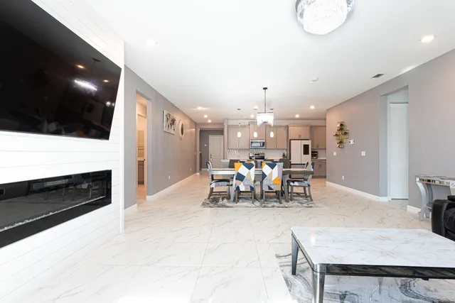 a kitchen with a table and chairs