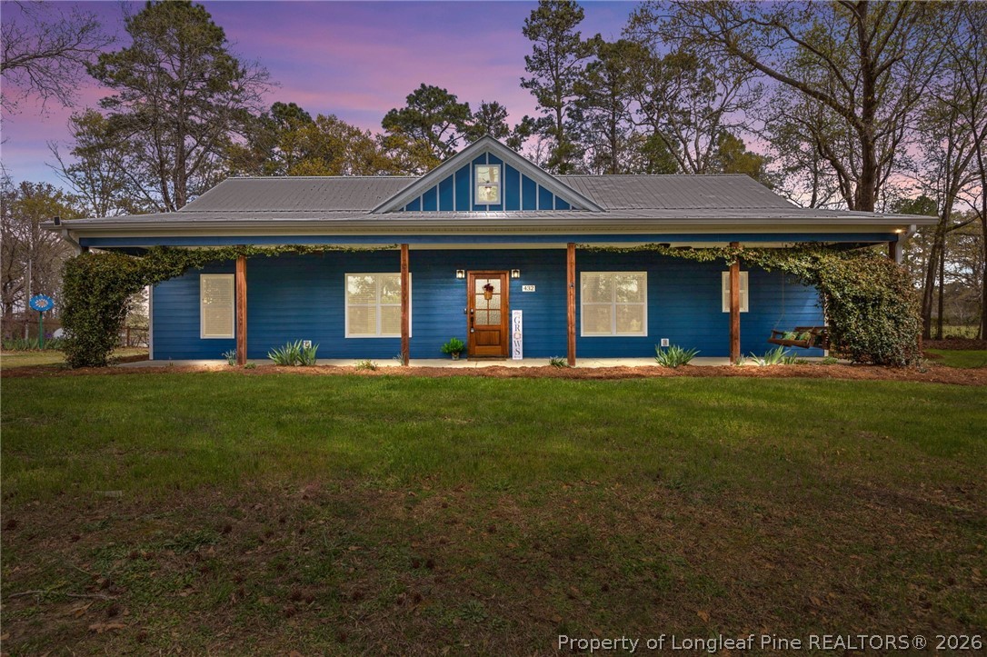 432 Pearidge Road Willow Spring, NC 27592 - Photo 1 of 47 a front view of a house with a garden