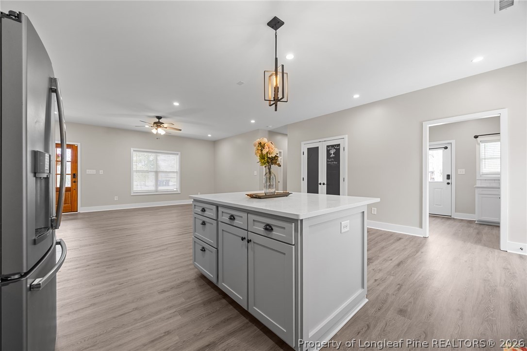 432 Pearidge Road Willow Spring, NC 27592 - Photo 11 of 47 a kitchen with a sink and wooden floor