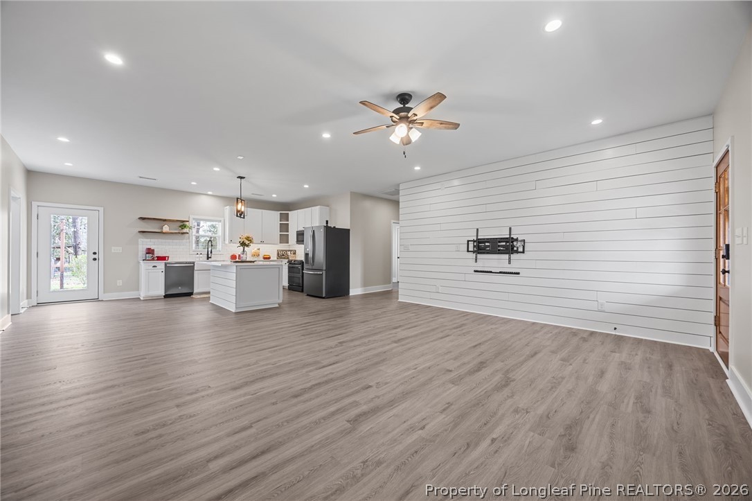432 Pearidge Road Willow Spring, NC 27592 - Photo 15 of 47 a view of empty room with wooden floor