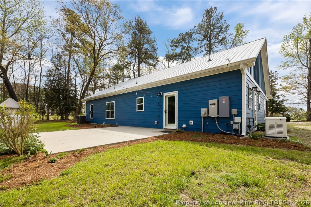 432 Pearidge Road Willow Spring, NC 27592 - Photo 2 of 47 a front view of a house with a yard and garage