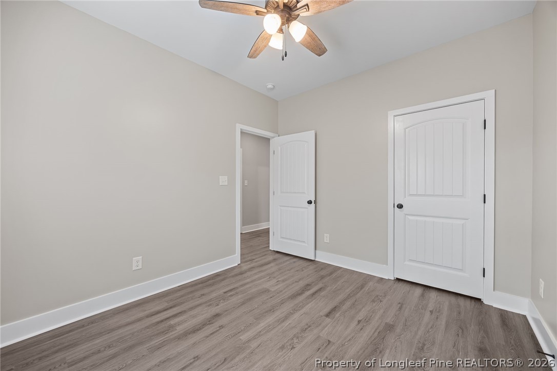 432 Pearidge Road Willow Spring, NC 27592 - Photo 24 of 47 wooden floor in an empty room with a window