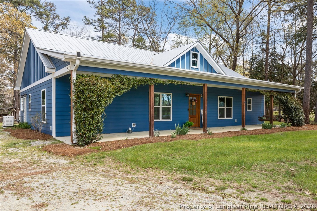 432 Pearidge Road Willow Spring, NC 27592 - Photo 3 of 47 a front view of a house with a yard and porch