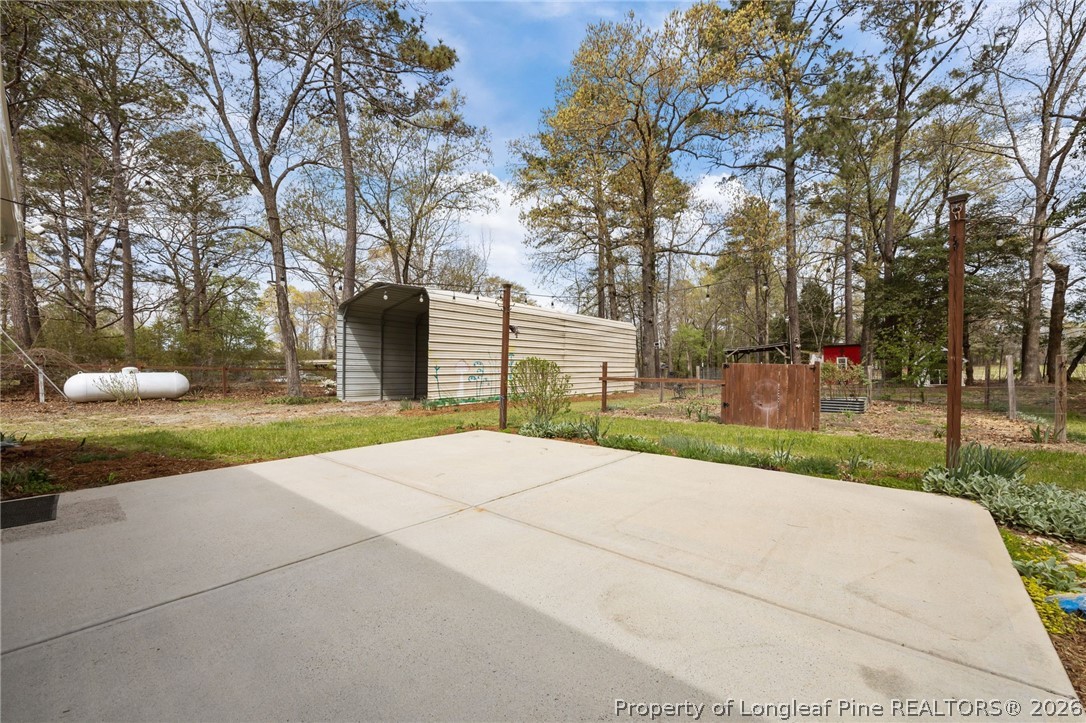432 Pearidge Road Willow Spring, NC 27592 - Photo 33 of 47 a view of a yard with plants and trees