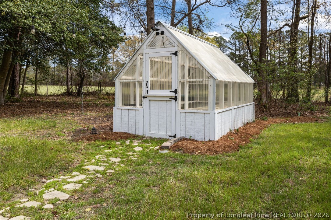432 Pearidge Road Willow Spring, NC 27592 - Photo 34 of 47 a view of a house with yard and sitting area