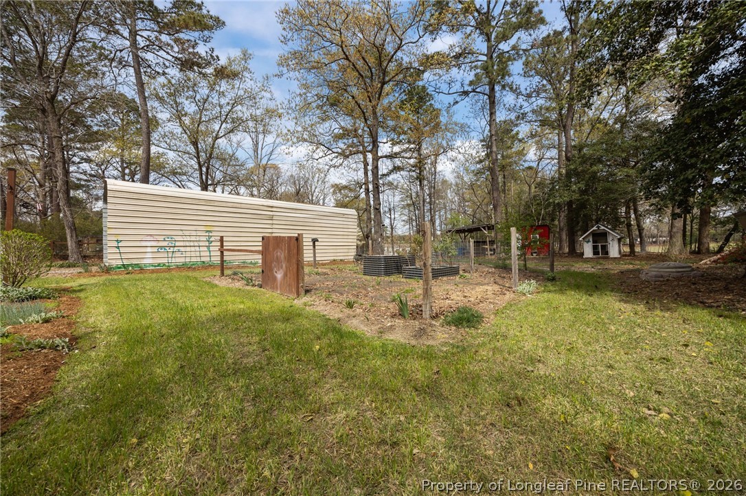 432 Pearidge Road Willow Spring, NC 27592 - Photo 35 of 47 a view of a house with a yard